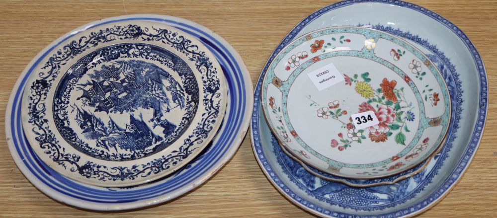 An early 19th century Chinese floral plate, a Chinese blue and white plate and meat platter, together with two other dishes